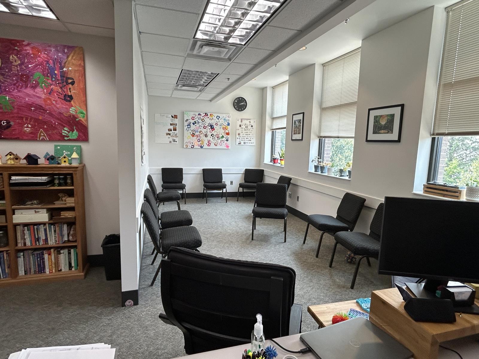 meeting room with chairs arranged in an oval circle